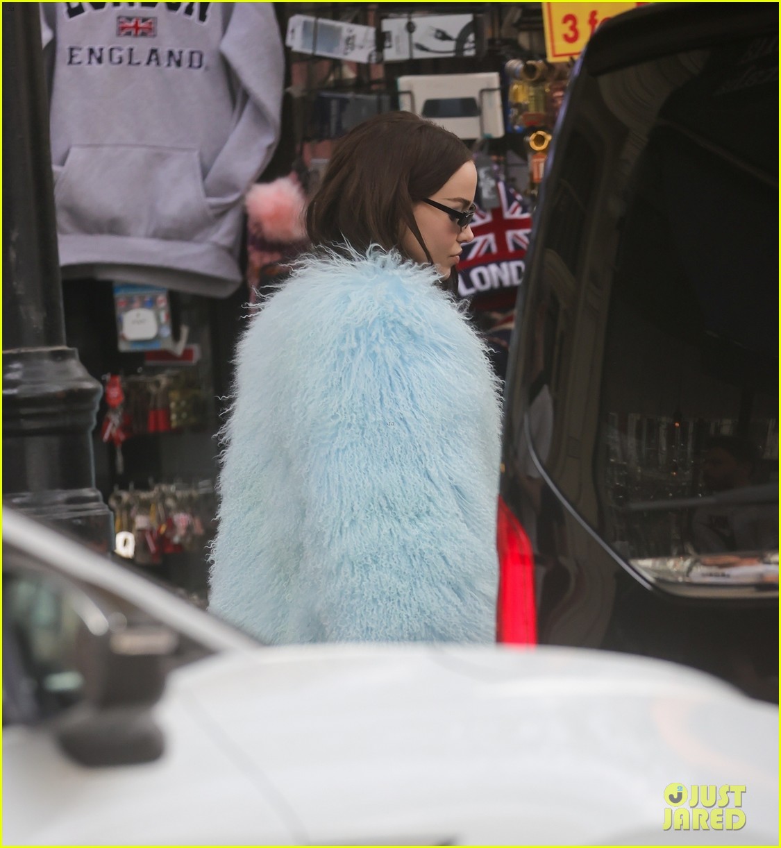 dove cameron wears fluffy blue jacket while out in london 06