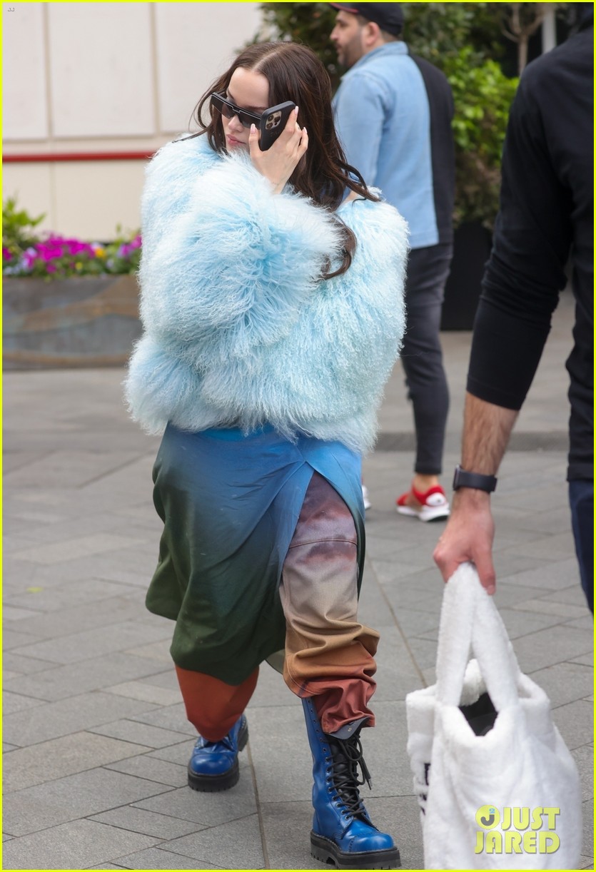 dove cameron wears fluffy blue jacket while out in london 09