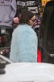 dove cameron wears fluffy blue jacket while out in london 06