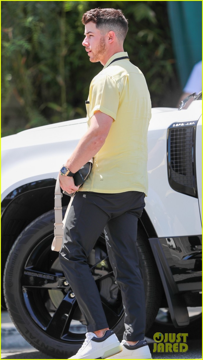 nick jonas sports bright yellow celine shirt for afternoon meeting 09