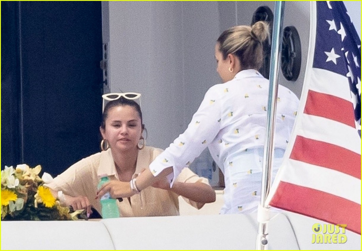 selena gomez gets help from andrea iervolino boarding yacht italy 34