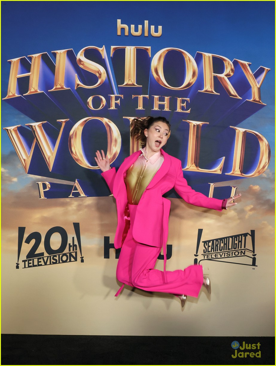dove cameron suits up for history of the world part 2 premiere 13