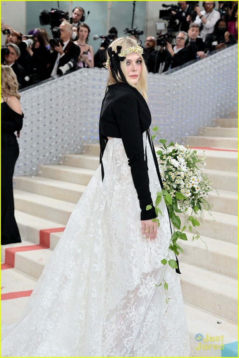 Elle Fanning Wears a Daisy Crown In Honor of Karl Lagerfled at the Met