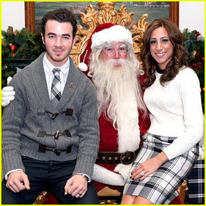 Kevin & Danielle Jonas Sit on Santa's Lap