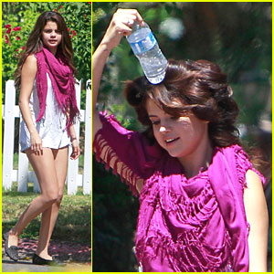 Selena Gomez Cools Down With Water Bottle On Her Head