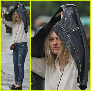 Dakota Fanning Hides From the NYC Rain!