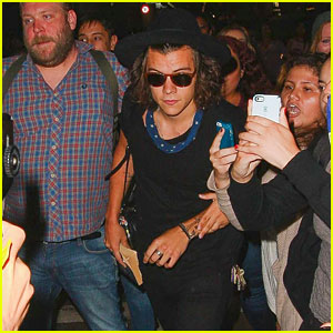 Harry Styles Attempts to Make His Way Through Crowd of Fans at LAX!