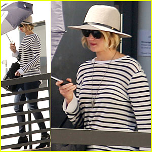 Jennifer Lawrence Hides From the Sun With Umbrella