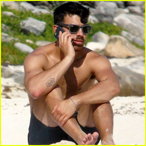 Joe Jonas Sits in the Sand Shirtless While Taking a Phone Call in Cancun