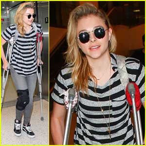 Chloe Moretz Uses Crutches For Knee Injury After Arriving Back In Los Angeles