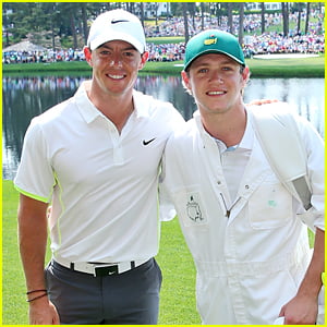 One Direction's Niall Horan Carries Golf Clubs As Rory McIlory's Caddie