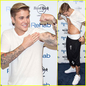 Justin Bieber Checks Out His Own Abs at Pool Party