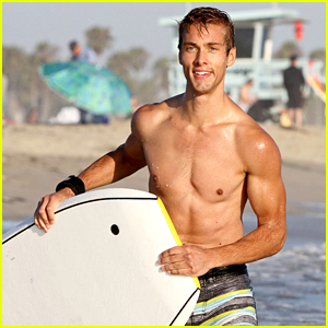 Shirtless Austin North Gets Wiped Out by Waves While Boogie Boarding