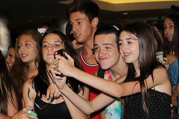 Cameron Dallas & Aaron Carpenter Surrounded By Welcoming Fans At LAX