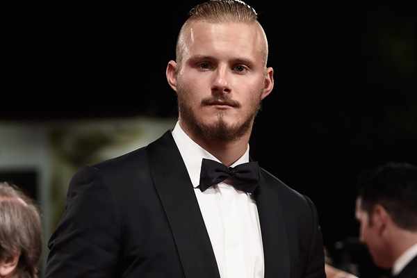 Alexander Ludwig Pretends To Bite Director Daniel Alfredson At ‘Go With Me’ Premiere in Venice