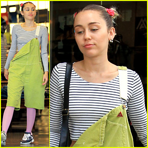 Miley Cyrus Wears Oversized Green Overalls with Pink Leggings