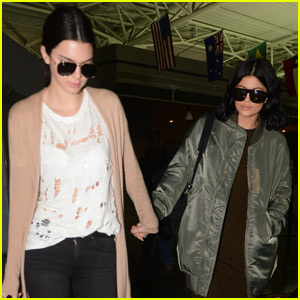 Kendall & Kylie Jenner Hold Hands While Landing in New York City