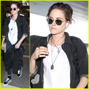 Kristen Stewart Keeps The Music On & the World Out At LAX Airport