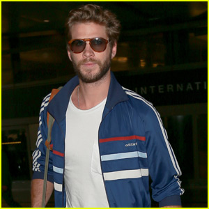 Liam Hemsworth Looks Straight Out of the 80s at LAX Airport