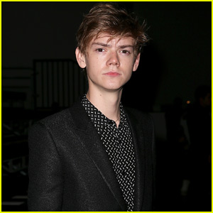 Thomas Brodie-Sangster Does a Lot of People Watching at Saint Laurent Paris Show!