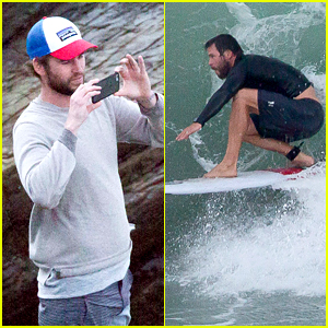 Liam Hemsworth Watches Brother Chris Surf The Day Away