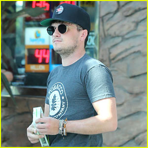 Josh Hutcherson Picks Up a Phone Charger from a Gas Station Store