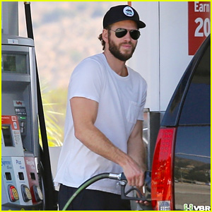 Liam Hemsworth Flashes His Bulging Biceps While Pumping Gas