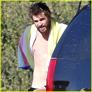 Shirtless Liam Hemsworth Shows Off His Muscles at the Beach
