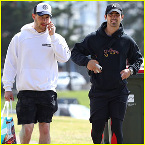 Nick Jonas Chats on the Phone While Stepping Out With Brother Joe