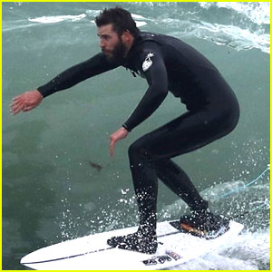 The Rain Won't Stop Liam Hemsworth from Surfing!