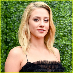 Lili Reinhart Meets Wolves At Wildlife Sanctuary in Canada