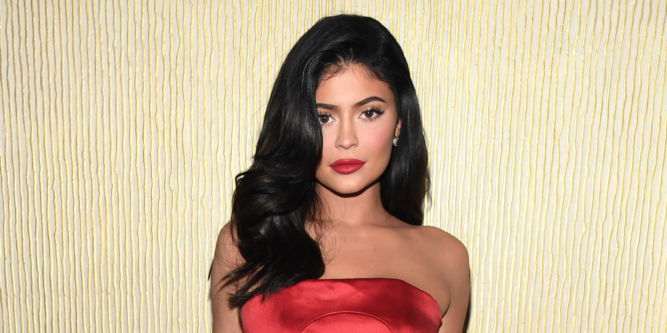 kylie jenner red dress pre grammy Kylie Jenner Wears Red Strapless Gown at Pre-Grammys Gala