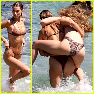 Bella Hadid Playfully Wrestles Sister Gigi at the Beach in Greece!