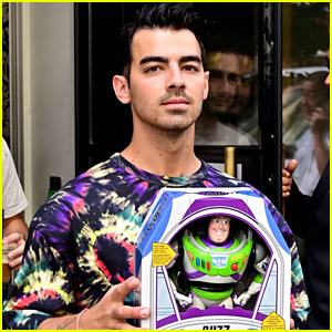 Joe Jonas Gets A Buzz Lightyear Toy in NYC