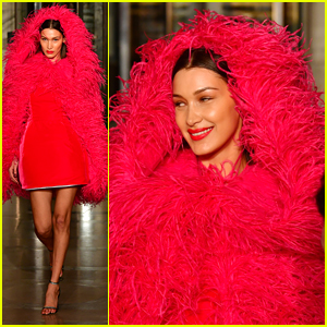 Bella Hadid Wears Red, Feathered Hooded Jacket For Oscar de la Renta Fashion Show