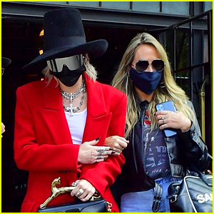 Miley Cyrus Wears a Top Hat & Chic Red Coat For Business Meeting in NYC