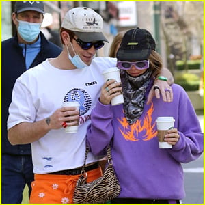 KJ Apa Picks Up Coffee To Go With Girlfriend Clara Berry During Walk in Vancouver