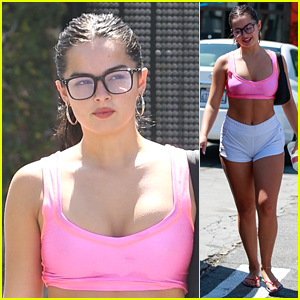 Addison Rae shows off her toned abs in a pink sports bra and