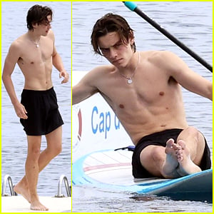 Louis Partridge Shows Off Shirtless Body While Paddleboarding in France During Cannes Film Festival